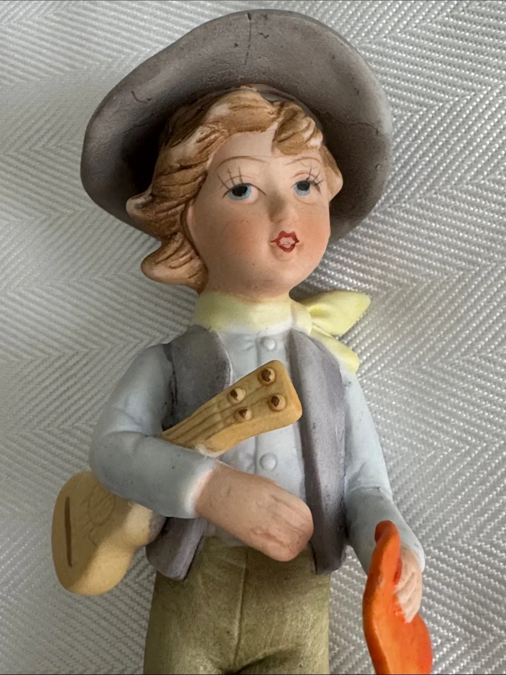 Hand-Painted Porcelain Boy Figurine in Neutral and Orange